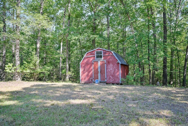 view of outbuilding with a lawn