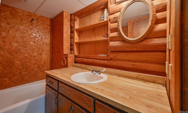 bathroom featuring a tub and vanity