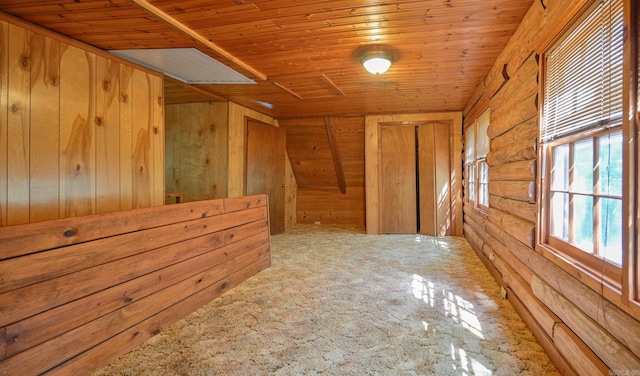 additional living space featuring wood ceiling, carpet floors, and wooden walls