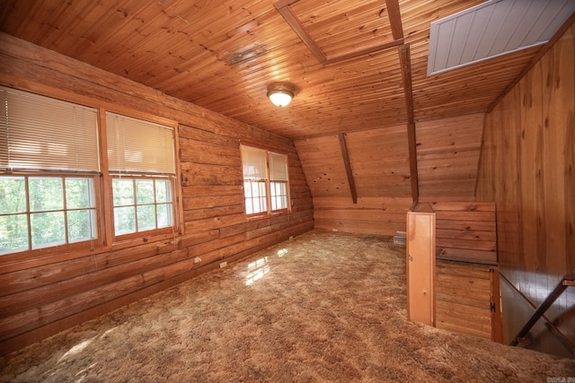 additional living space featuring wood walls, wooden ceiling, carpet floors, and vaulted ceiling