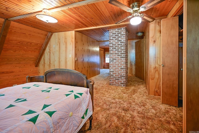 bedroom with carpet, wooden ceiling, ceiling fan, and wooden walls