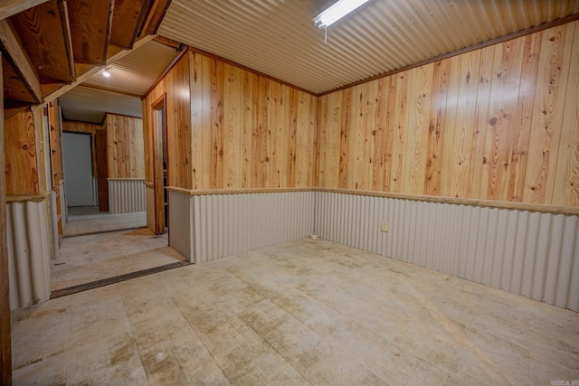 empty room featuring wooden walls