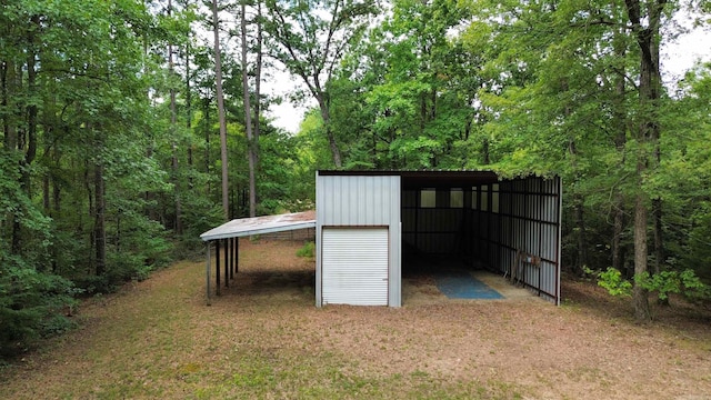 exterior space featuring an outbuilding and a carport