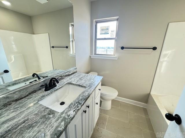 full bathroom with tile patterned floors, vanity, shower / bathtub combination, and toilet