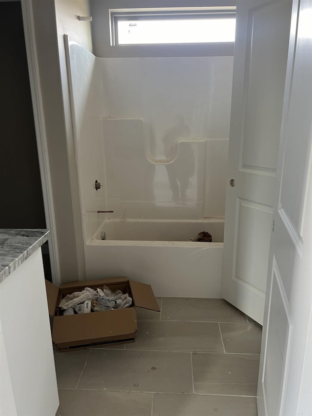 bathroom with tile patterned floors, vanity, and shower / bathtub combination