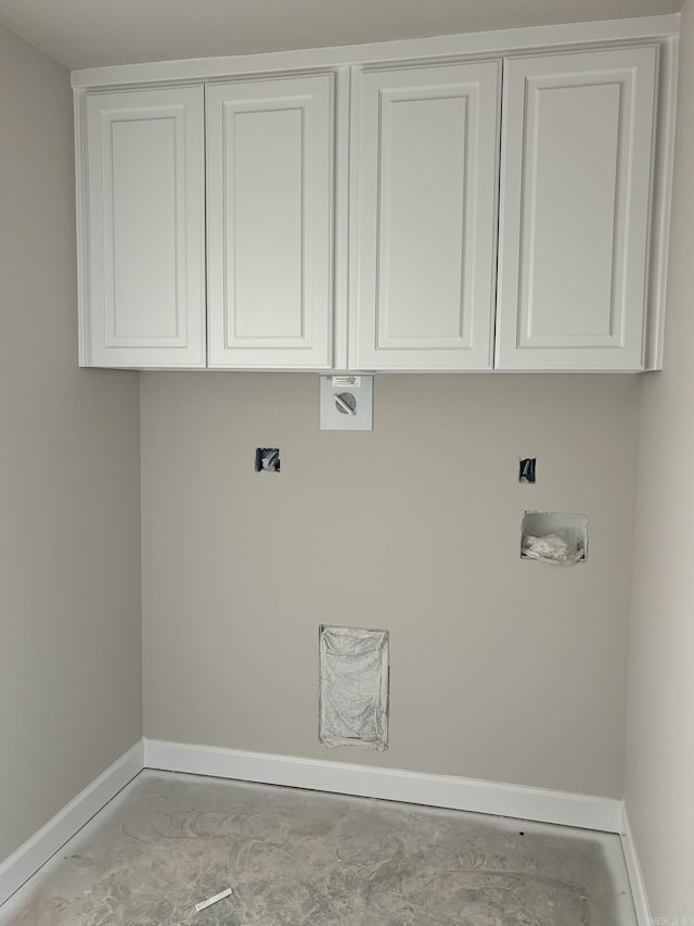 clothes washing area featuring cabinets and hookup for an electric dryer