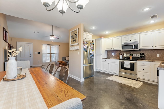 kitchen featuring ceiling fan with notable chandelier, appliances with stainless steel finishes, backsplash, and white cabinetry