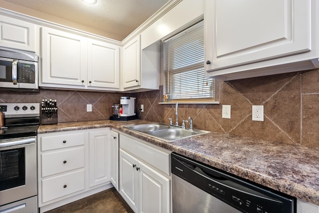 kitchen featuring sink, white cabinets, and stainless steel appliances