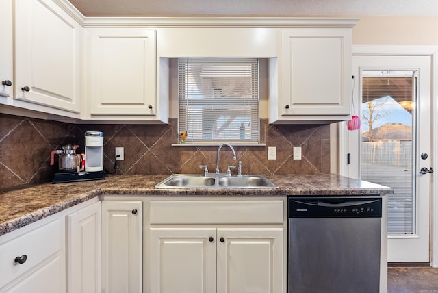 kitchen featuring stainless steel dishwasher, plenty of natural light, white cabinets, and sink