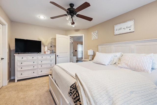 bedroom with ceiling fan and light colored carpet