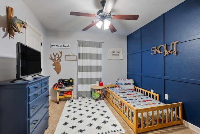 carpeted bedroom featuring ceiling fan