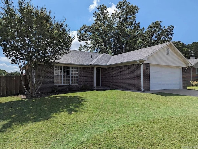 ranch-style home with a front lawn and a garage