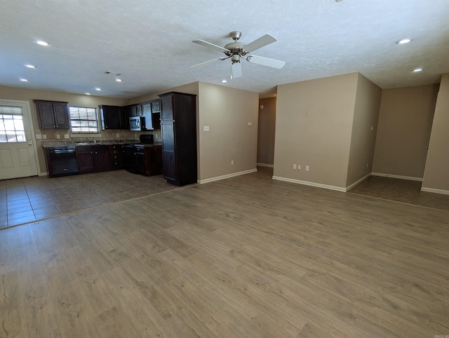 kitchen with dark brown cabinetry, ceiling fan, dishwasher, a textured ceiling, and hardwood / wood-style flooring