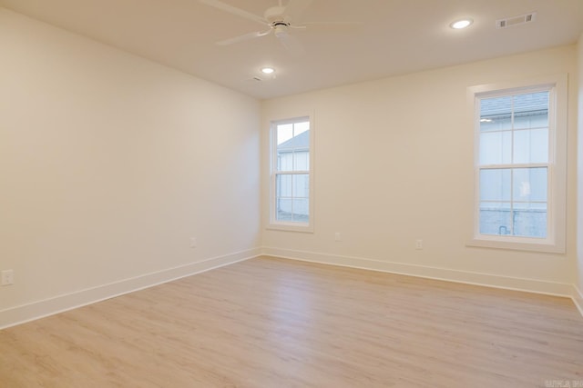 spare room with ceiling fan and light hardwood / wood-style flooring