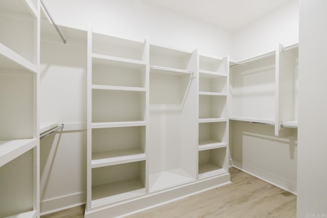 walk in closet featuring hardwood / wood-style flooring