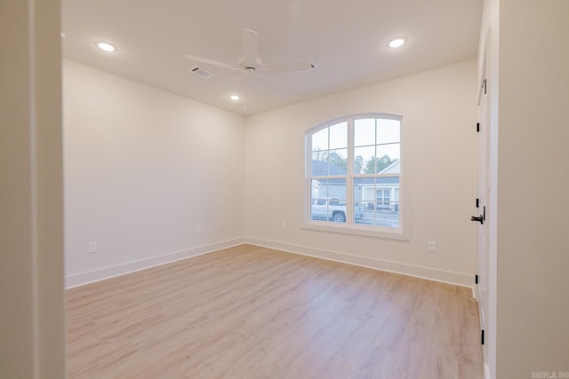 spare room with ceiling fan and light hardwood / wood-style flooring