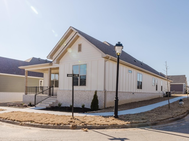 view of side of property featuring a porch