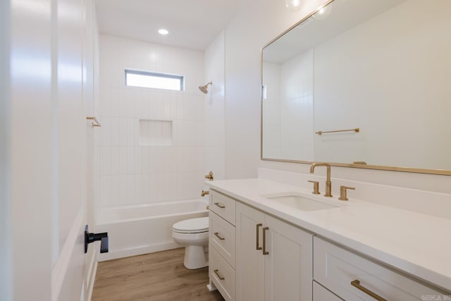 full bathroom with vanity, shower / bathtub combination, toilet, and wood-type flooring