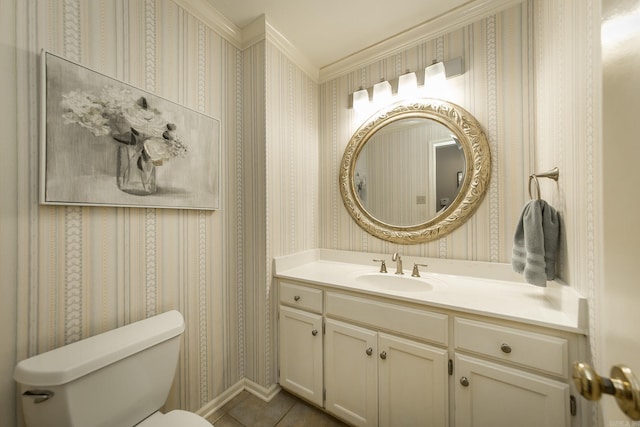 bathroom with tile patterned flooring, toilet, vanity, and ornamental molding