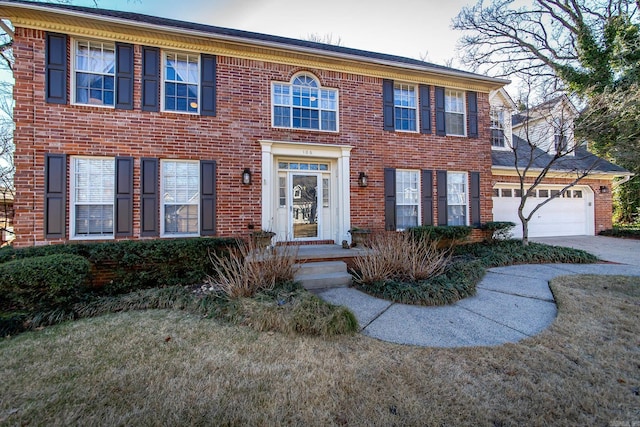 colonial-style house featuring a garage