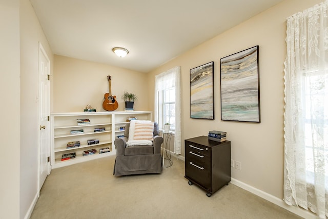 sitting room with light colored carpet