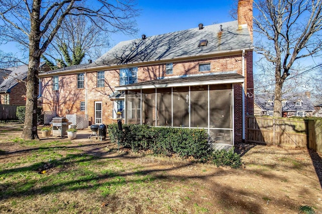 rear view of house with a sunroom