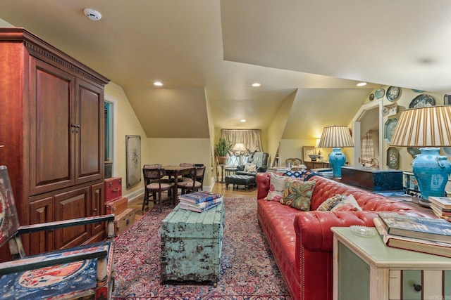 living room featuring lofted ceiling