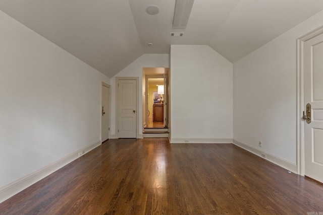 bonus room featuring dark wood-type flooring and lofted ceiling