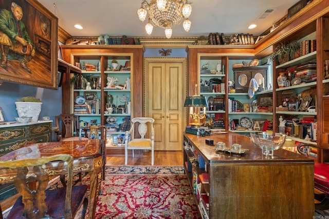 office space featuring dark hardwood / wood-style flooring and an inviting chandelier