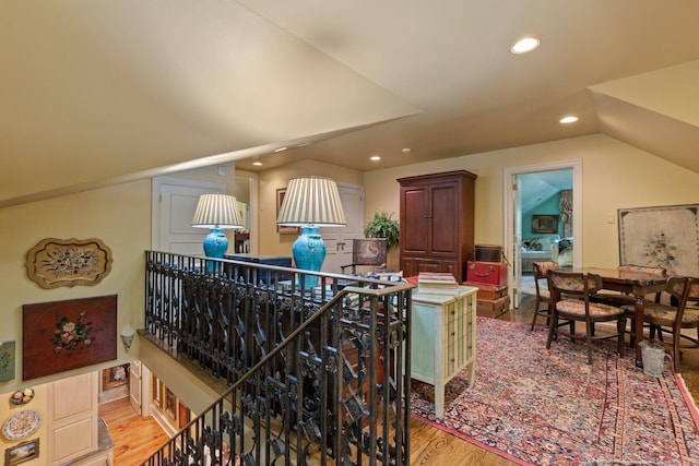 bonus room featuring vaulted ceiling and hardwood / wood-style flooring