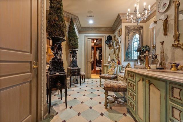 interior space featuring ornamental molding and an inviting chandelier