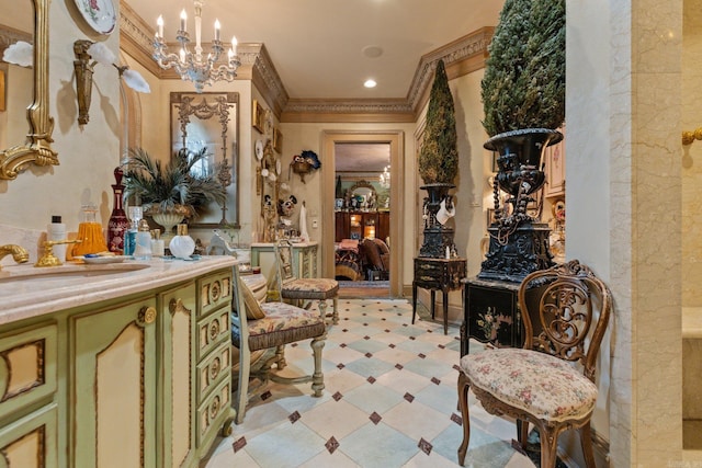 living area with crown molding, sink, and a chandelier