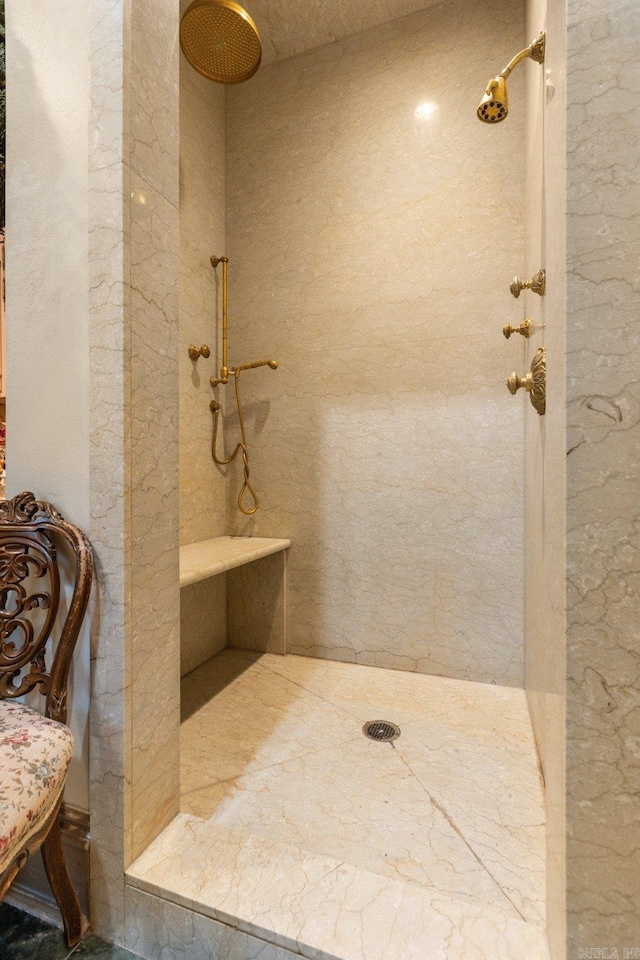 bathroom featuring a tile shower