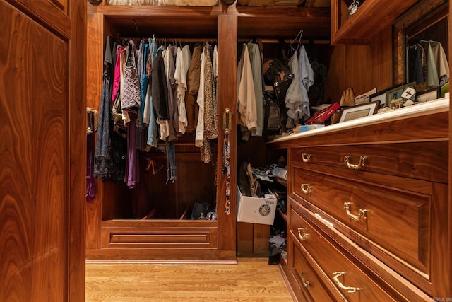 walk in closet featuring light hardwood / wood-style flooring