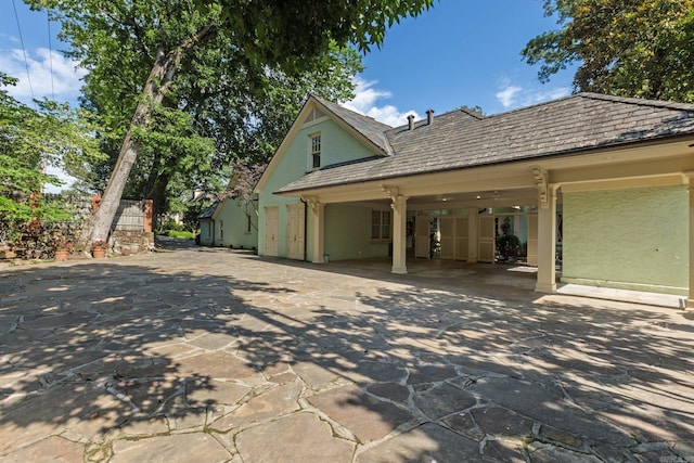 view of side of home with a patio area