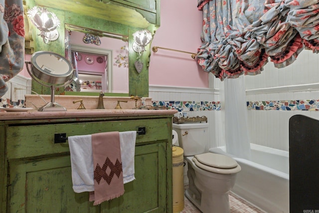 full bathroom with vanity, toilet, and shower / tub combo with curtain