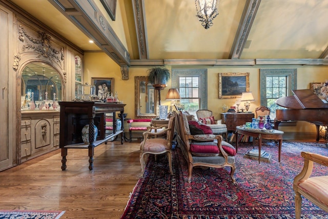 living area featuring hardwood / wood-style floors and an inviting chandelier