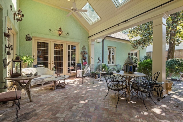 view of patio featuring outdoor lounge area, french doors, and ceiling fan