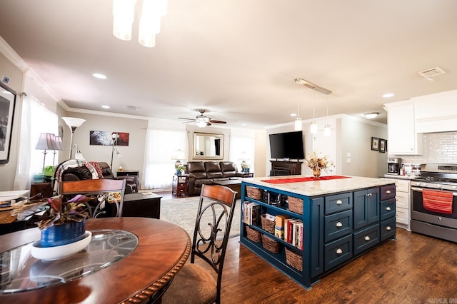 kitchen featuring blue cabinetry, ceiling fan, dark wood-type flooring, stainless steel range oven, and white cabinets