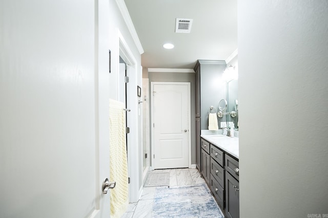 bathroom featuring a shower, vanity, and ornamental molding