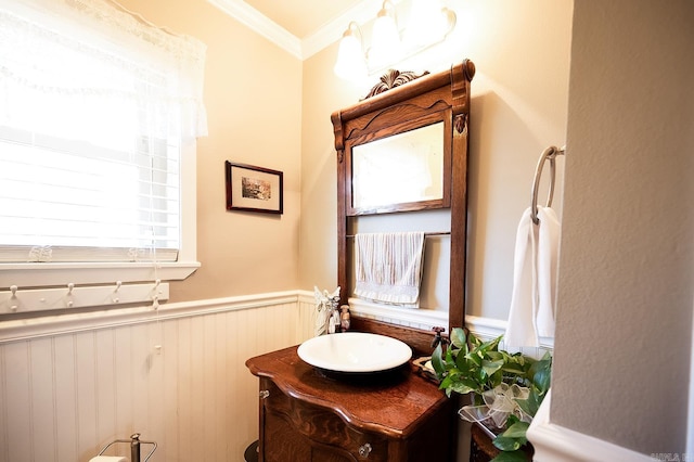 bathroom featuring crown molding and vanity