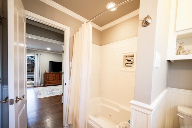 bathroom featuring toilet, wood-type flooring, ornamental molding, and shower / tub combo with curtain