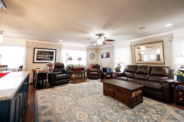 living room with ceiling fan, ornamental molding, and hardwood / wood-style flooring