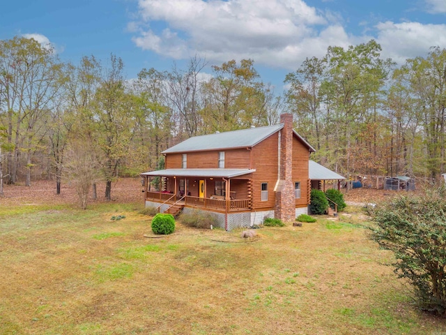 back of house featuring a porch and a yard