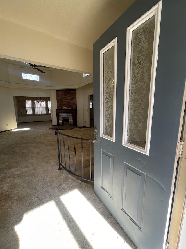 entrance to property featuring ceiling fan