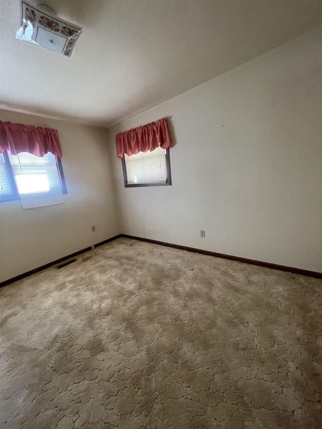 spare room featuring carpet floors