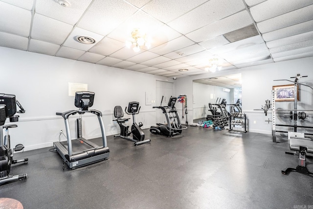 workout area featuring a drop ceiling