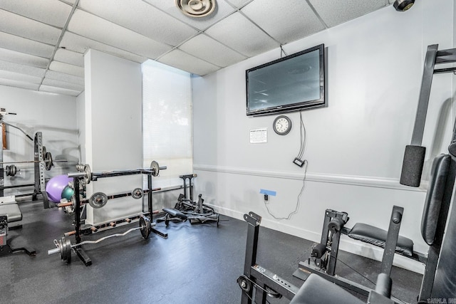 exercise room featuring a paneled ceiling