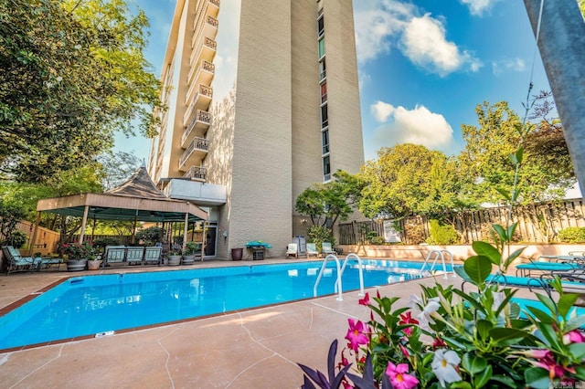 view of swimming pool with a gazebo