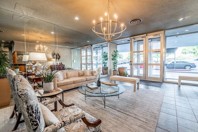 living room with tile patterned flooring, a textured ceiling, and an inviting chandelier